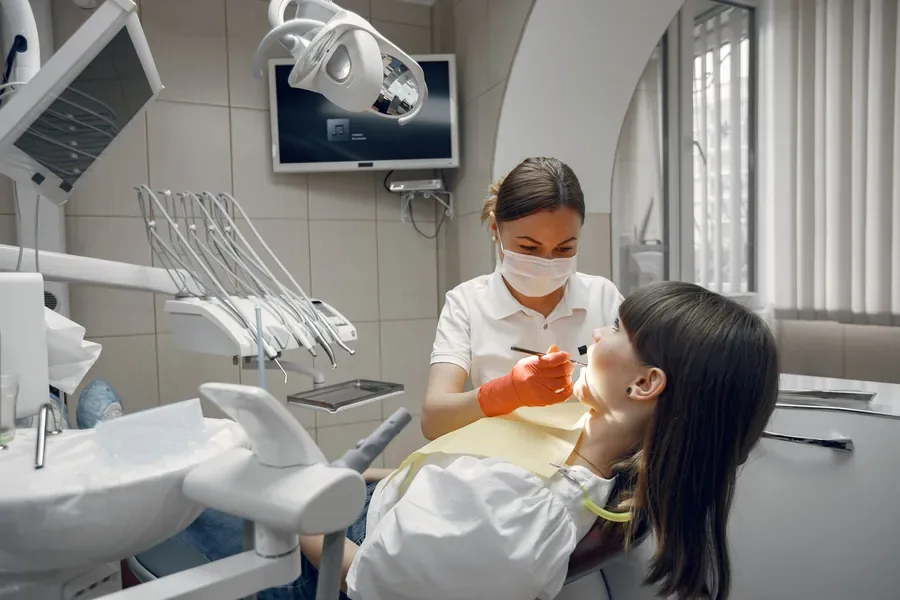 Dentist carrying out a root canal examination on a patient in Islamabad